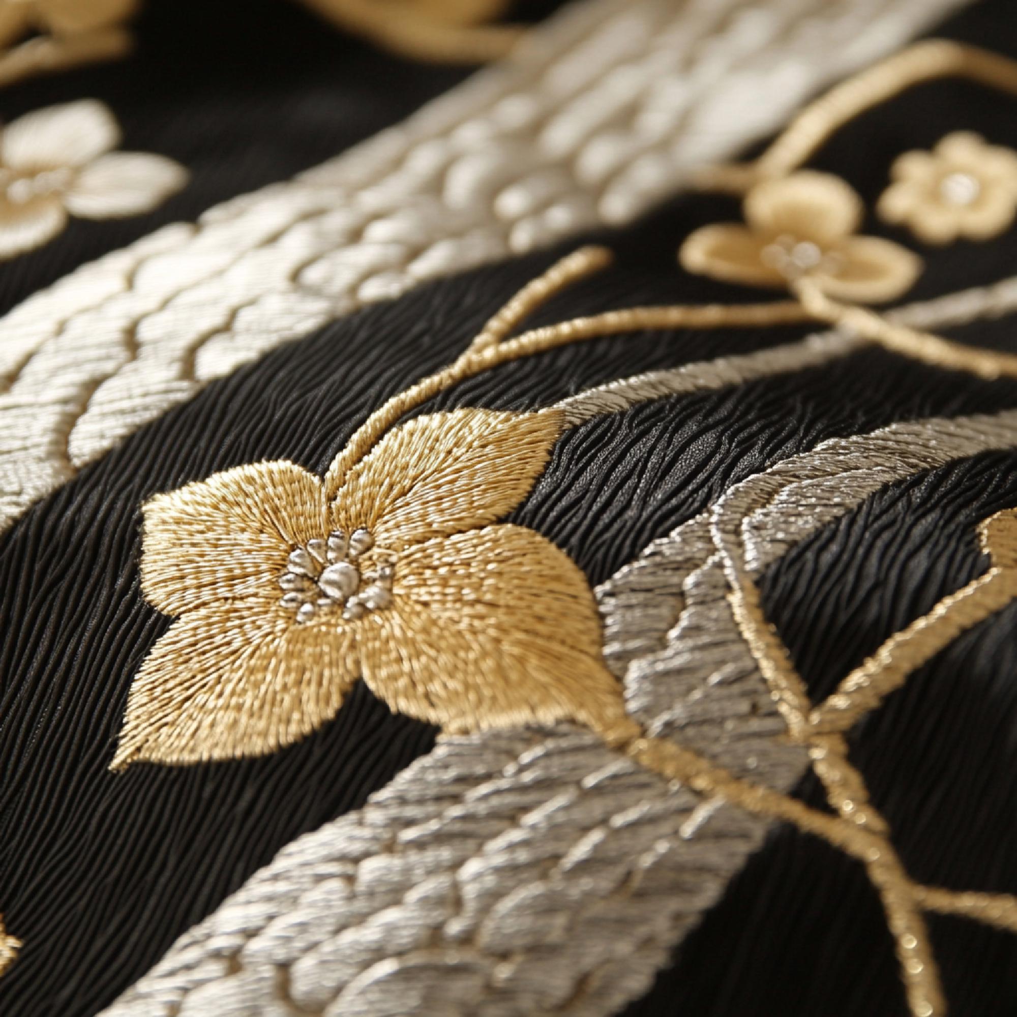 Delicate gold-thread embroidery on cotton